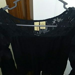 Sheer black long sleeved blouse.